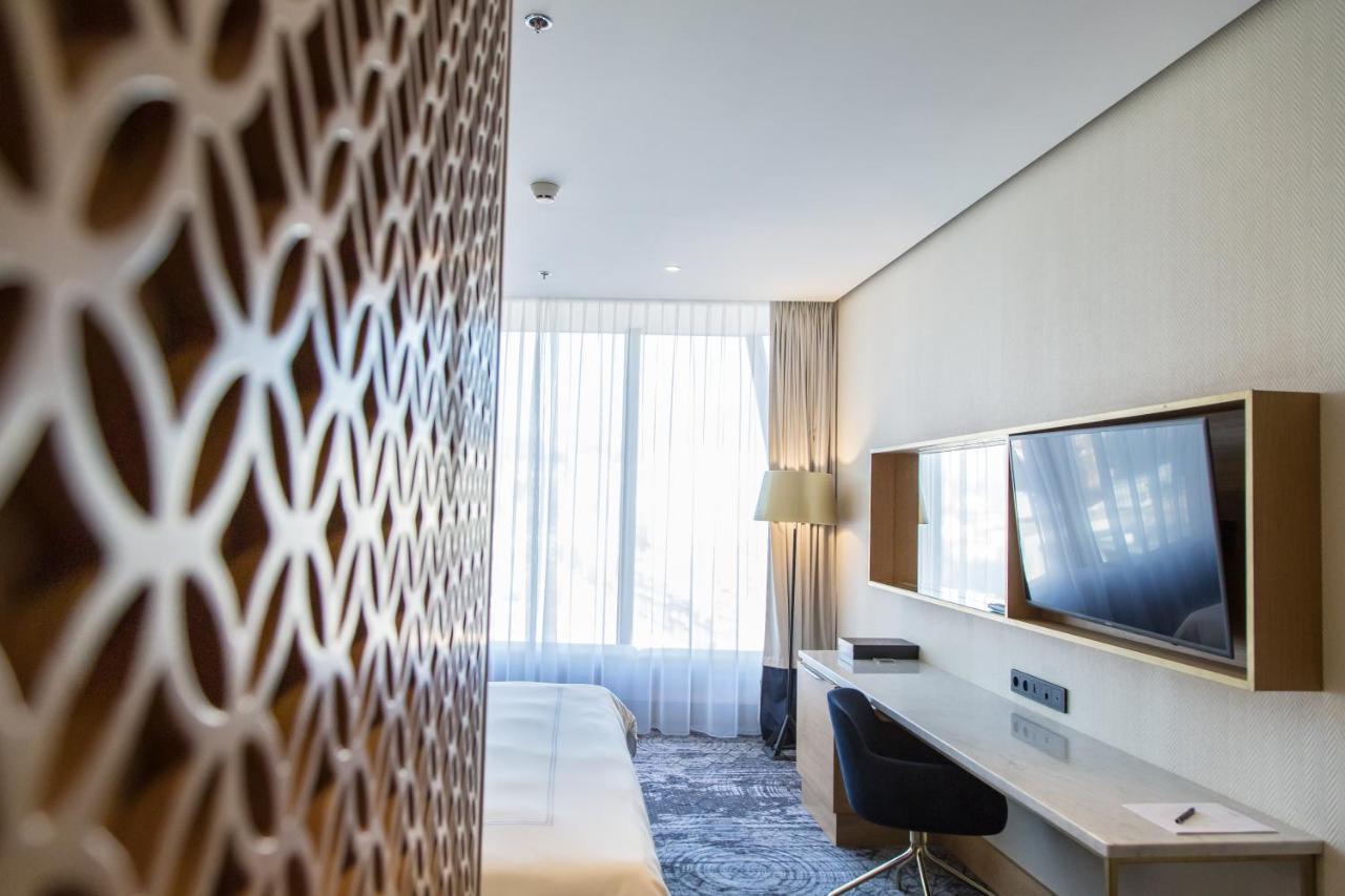 Swissotel SJJ Extérieur photo A room at the hotel